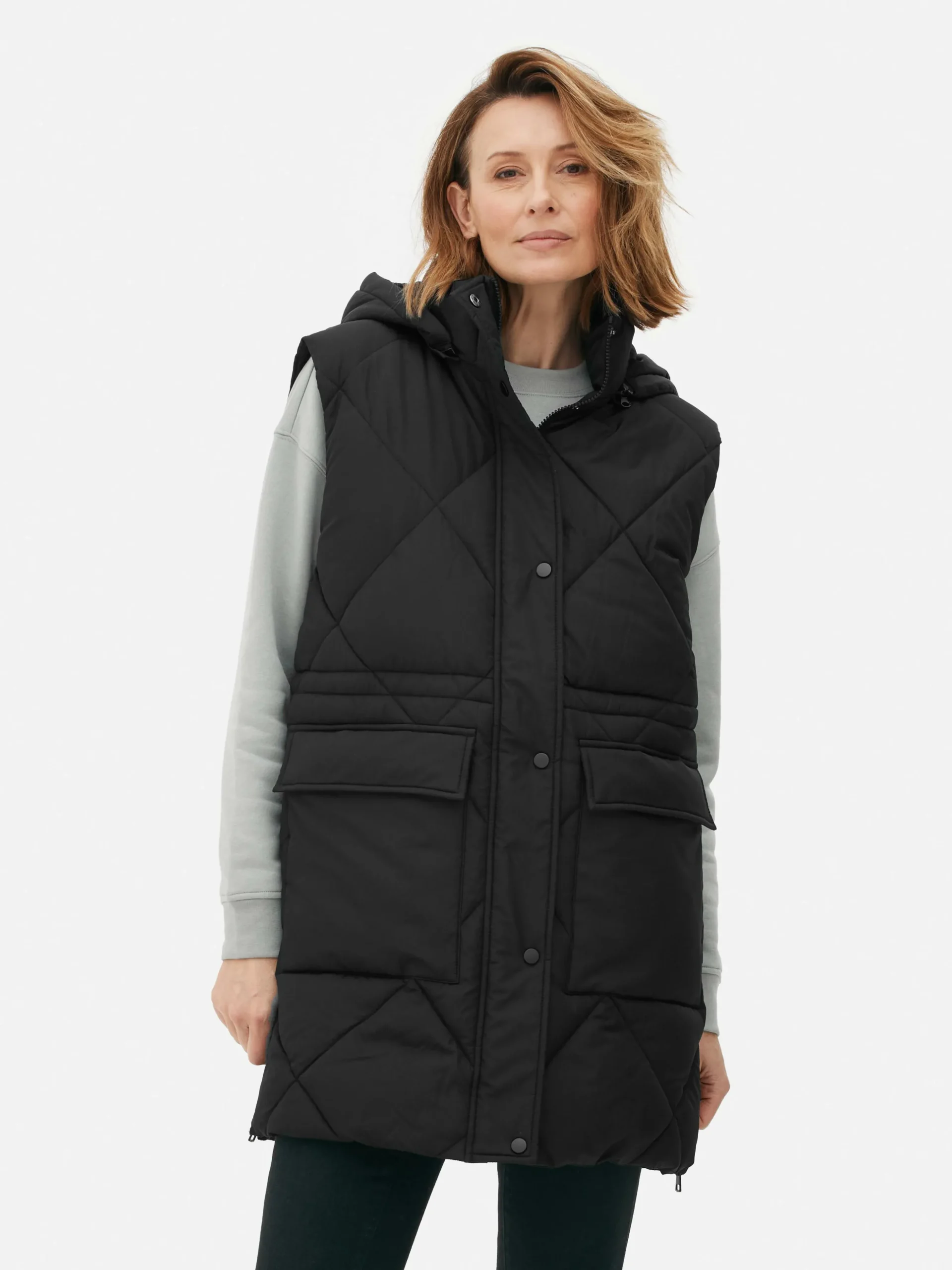 Lange Pufferbodywarmer Met Capuchon