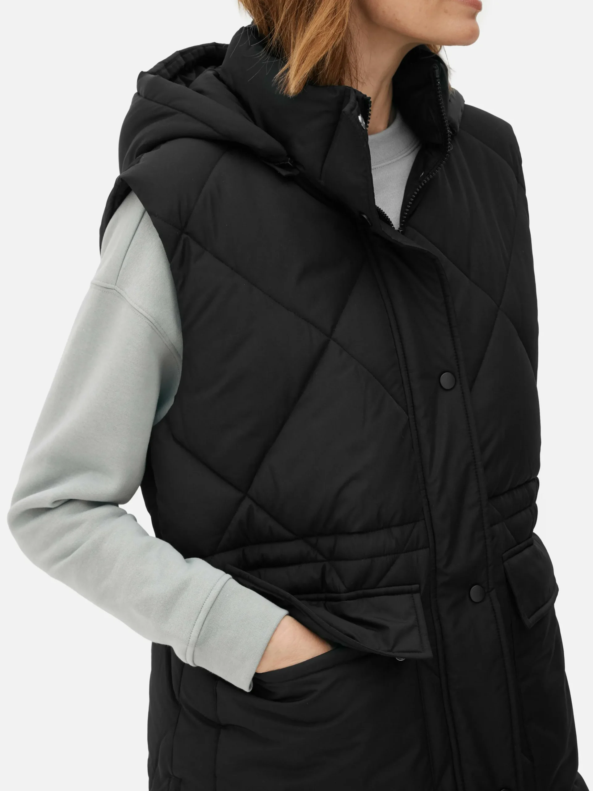 Lange Pufferbodywarmer Met Capuchon